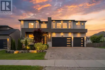Welcome to 1010 Longworth Road, a custom-built walk-out estate on a premium ravine lot in one of Sou...
