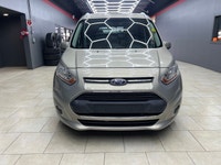 Experience the elegance and sophistication of the gold 2015 Ford Transit Connect Wagon Titanium with... (image 9)