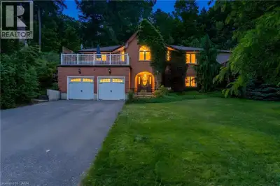 A STATEMENT HOME. Tucked away on a sprawling 1/3-acre private treed lot, 37 Yellow Birch Drive is fa...