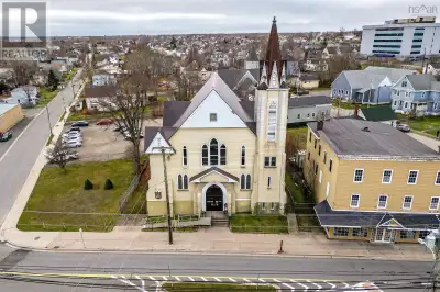 Stately building in the centre of downtown Glace Bay with many upgrades including a steam furnace th...