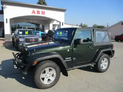 Get ready for adventure with this 2010 Jeep Wrangler Sport 4x4 2-Door Soft Top, showing only 121,547...
