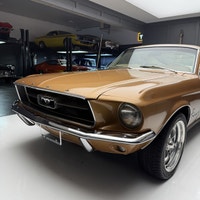Check out this 1967 Ford Mustang Fastback. This is a gorgeous car. The gold paint is incredible and... (image 6)