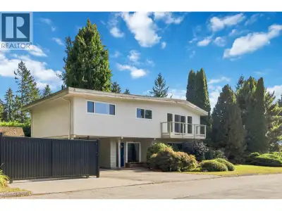 Welcome to this stunning family home on a quiet, exceptionally private corner lot in Upper Blueridge...