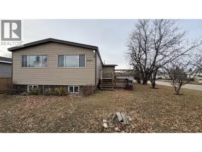 Welcome to this super affordable double wide manufactured home with basement on its' own corner lot...