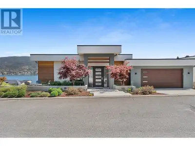 This modern lakeside retreat blends sleek design with the panoramic Okanagan Lake and mountain views...