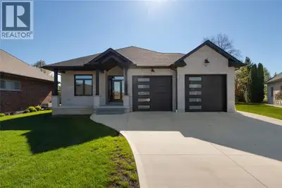 Beautiful brick home with stone front, tucked at the end of a quiet street on a premium lot opening...
