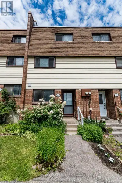 This beautiful open concept 4 story condo townhouse owned by the same family for over 20 years tucke...
