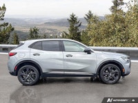 This 2023 Buick Envision Essence SUV is a head-turner, boasting a sleek Moonstone Grey Metallic exte... (image 5)