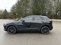 // ACCIDENT FREE!! // Finished in Black with a Burgundy interior, this used 2022 Mazda CX-30 GT w/Tu... (image 9)