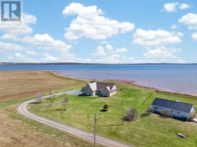 Set on an exceptional nearly 3 acre parcel on McInnis Point with 280 feet of pristine sandy shorelin...