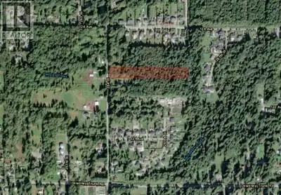 Development potential! 4.76 acres, zoned RS3, and Not in ALR. The terrain is flat, and offers unlimi...