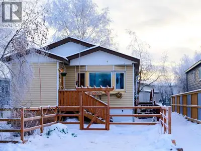 3-bedroom, 1-bathroom home in Northlands features a large fenced yard with mature trees. The home op...