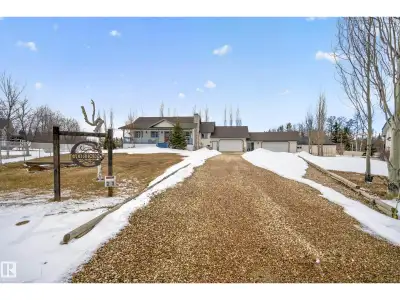 Meticulously cared for and updated raised bungalow on over half an acre with TWO DOUBLE CAR attached...