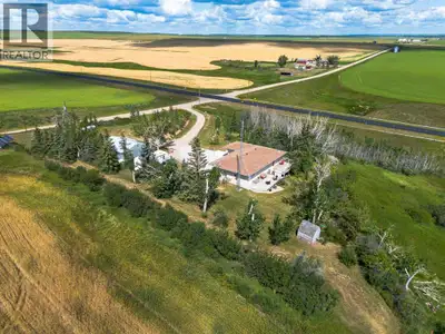 Welcome to this charming acreage, located just off the pavement and only 10 minutes from Three Hills...