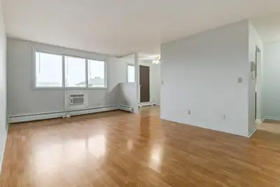 Amenities: Quiet Building • Air Conditioning • City Views Suite & Building: Spacious one-bedroom and...