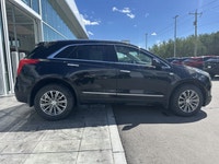 The 2019 Cadillac XT5 Luxury AWD, finished in black with a black leather interior, offers a refined... (image 4)