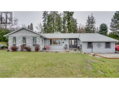 Charming Rancher with Lake & Mountain Views on half of an Acre in Salmon Arm Enjoy stunning mountain...