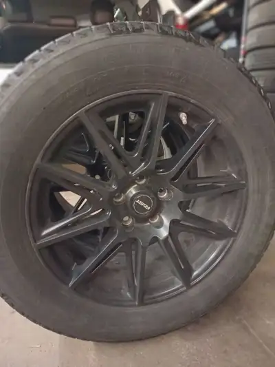 For sale a set of 4 used aluminum rims + winter tires Michelin Latitude Ice 235-65-18, 106T. Tread 7...