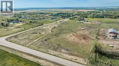 Offering of 19.2 Acres of development land located immediately SW of Springbank High School and the...