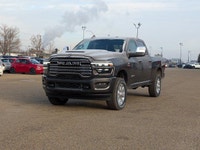 The 2026 Ram 3500 Laramie Crew Cab in Granite Crystal Metallic combines heavy-duty capability with p... (image 1)