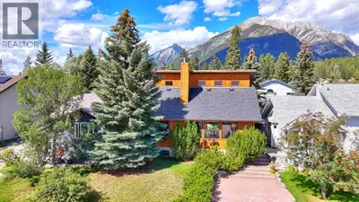 Experience the best of Canmore living in this beautifully maintained bright and sunny 6-bedroom home...