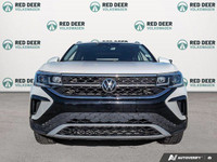 The 2024 Volkswagen Taos Highline, finished in a pristine white, comes equipped with an all-wheel-dr... (image 2)