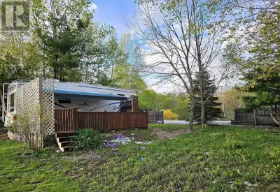 Situated just over 2 kms from Kejimkujik National Park, this 6300 sq. ft. lot with 5th-wheel trailer...