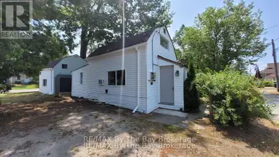 Compact two-bedroom home ideal for a single person or a couple. Features newer windows, updated floo...
