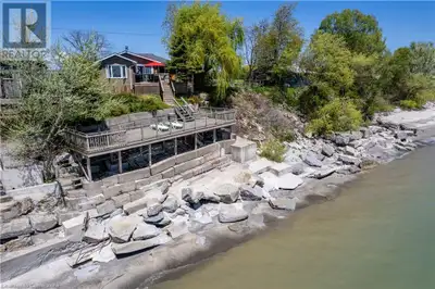 Your serene escape awaits. Nestled on the tranquil shores of Lake Erie, this gorgeous waterfront cot...