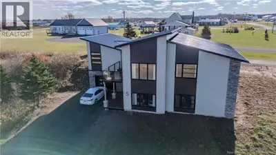 Two Homes in One with Stunning Waterviews! Welcome to this beautifully designed 1.5-year-old propert...
