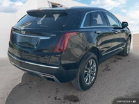 The 2021 Cadillac XT5 Premium Luxury includes a panoramic roof, ventilated front seats, heated rear... (image 4)