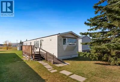 Welcome to this comfortable and WELL-KEPT 2 BEDROOM, 1.5-bath mobile home on an OWNED LOT BACKING ON...