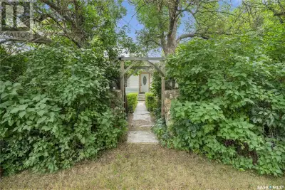Situated on a generous double lot surrounded by mature trees and privacy hedges, this charming prope...
