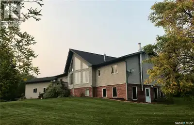 This gorgeous acreage is a must to see! Large walk-out bungalow is situated on 10 acres with a beaut...