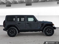 This *2021 Jeep Wrangler 4xe Unlimited Rubicon* combines legendary off-road capability with modern p... (image 6)