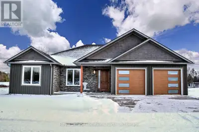 Experience the charm of a unique floor plan that makes this golf course bungalow both welcoming and...