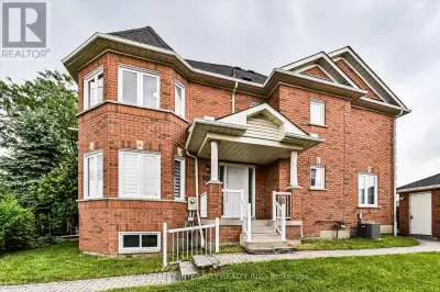 Rarely offered end-unit townhome situated on a premium 51' x 91' lot. Abundant side windows flood th...