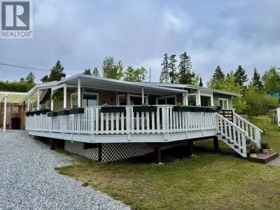 A must see to fully appreciate a rare beachfront in a quiet peaceful bay. Not just a summer home. Ye...