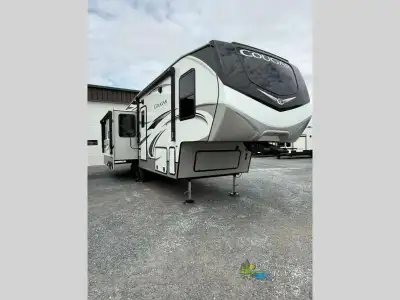 Keystone Cougar fifth wheel 290RLS highlights: Patent-Pending Windshield Kitchen Island Theater Seat...
