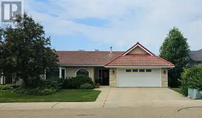 Welcome to your dream home, perfectly situated on the 15th hole of the prestigious Lacombe Golf and...