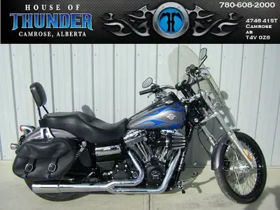 2014 Harley-Davidson FXDWG Wide Glide. Low-down and beefy, its got old-school chopper looks with the...