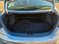 Experience the sophisticated charm of the 2024 Kia Forte LX IVT, presented in a sleek Gray finish wi... (image 6)