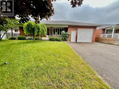 Feel right at home in this comfortable bungalow with 3 bedrooms, 2 kitchens, easy rental situation a...