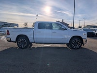 The 2026 Ram 1500 Longhorn Crew Cab in Ivory Tricoat Pearl combines rugged capability with refined l... (image 7)