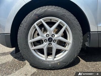 Command the road and embrace adventure in this sophisticated 2023 Ford Edge SEL, striking in Silver.... (image 9)