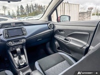 Designed for efficiency and confident urban navigation, this vibrant red 2024 Nissan Versa SV, is yo... (image 9)