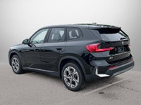 The 2025 BMW X1 xDrive28i arrives as a striking black Sport Utility vehicle, seamlessly blending ath... (image 8)
