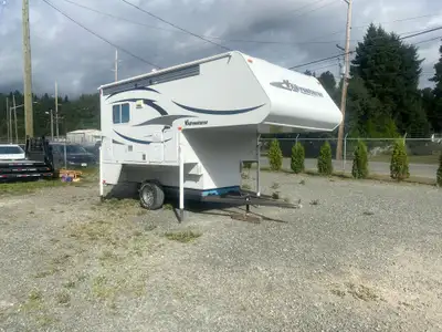 Slide-out truck camper featuring a unique bunk bed room layout, weighting approximatley 3100-3254 po...