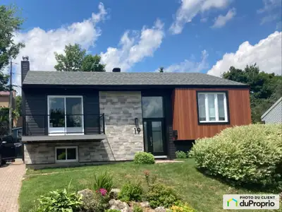 Charmante maison familiale située dans un secteur tranquille, intime et prisé, à proximité des école...