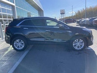 The 2024 Cadillac XT5 Standard AWD, finished in Stellar Black Metallic, combines refined styling, ad... (image 9)
